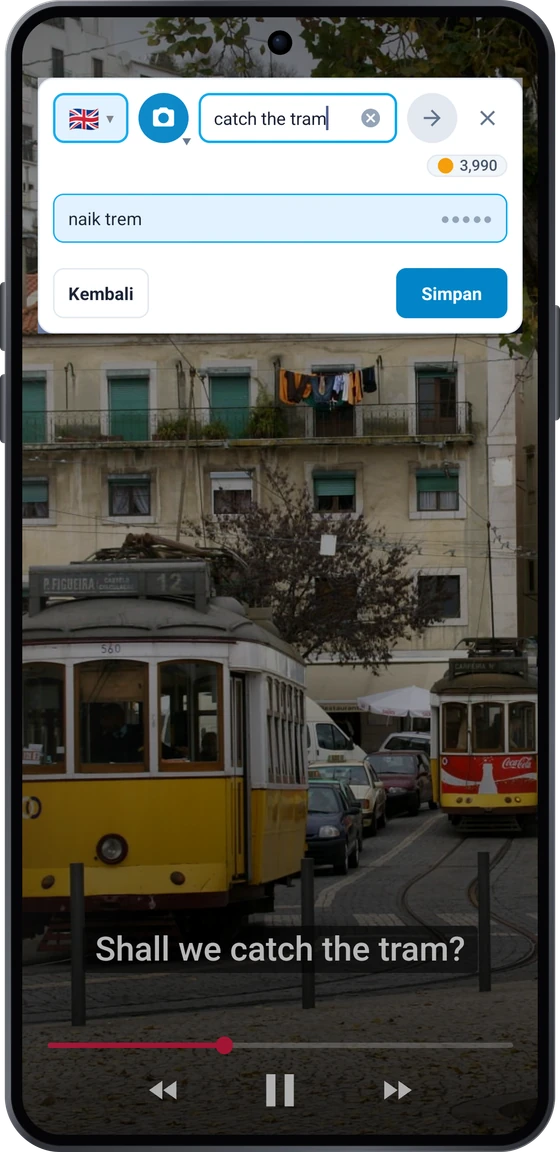 Tombol mengambang di atas video di Android: frasa subtitel apanhar o elétrico dengan terjemahan take the tram dan catch the tram