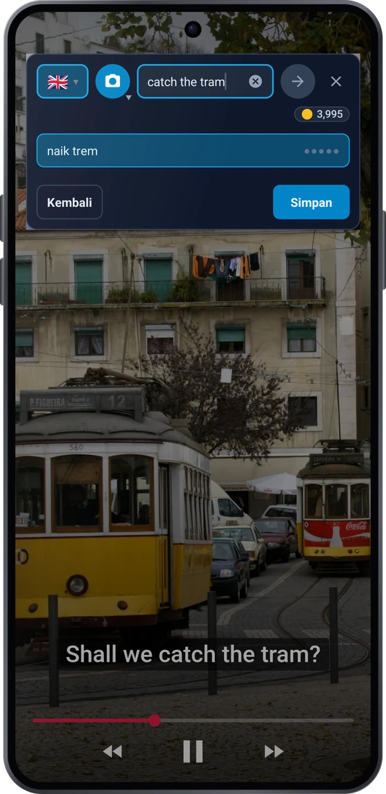 Tombol mengambang di atas video di Android: frasa subtitel apanhar o elétrico dengan terjemahan take the tram dan catch the tram