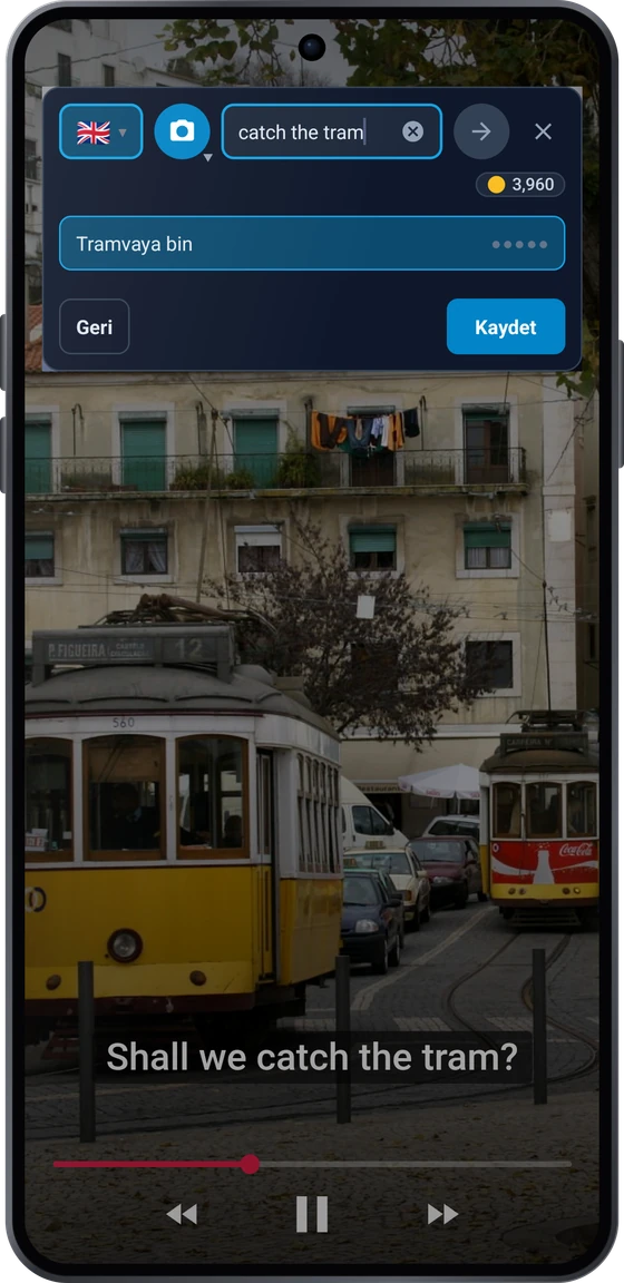 Android’de bir videonun üzerindeki kayan düğme: altyazıdaki apanhar o elétrico ifadesi ve take the tram, catch the tram çevirileri