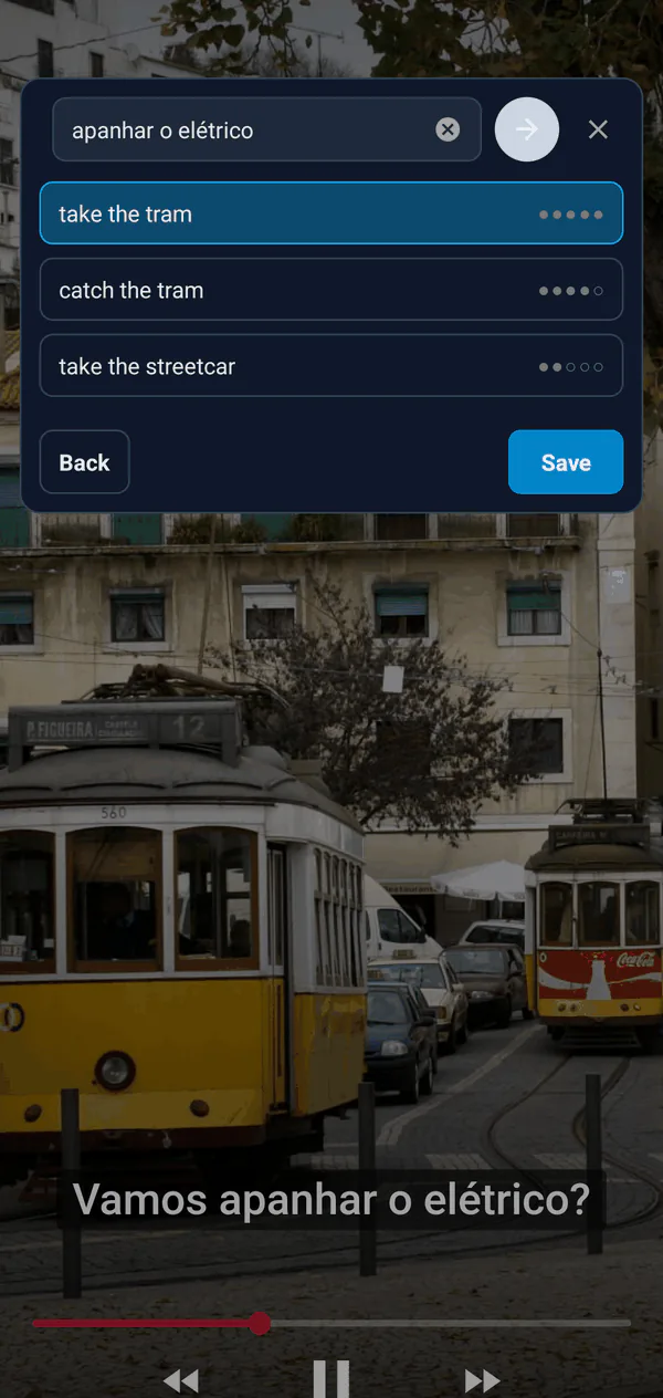 The capture bubble over a video: the subtitle phrase apanhar o elétrico with the translations take the tram and catch the tram