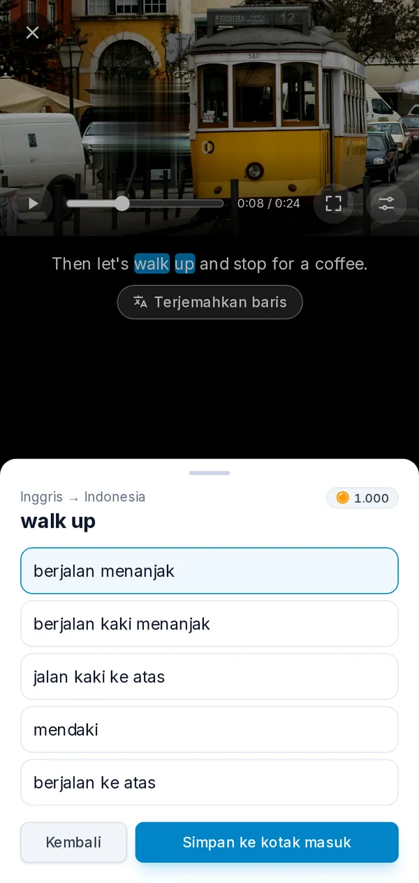 Pemutar di ponsel: video yang dijeda dengan frasa yang dipilih dari subtitel beserta terjemahannya