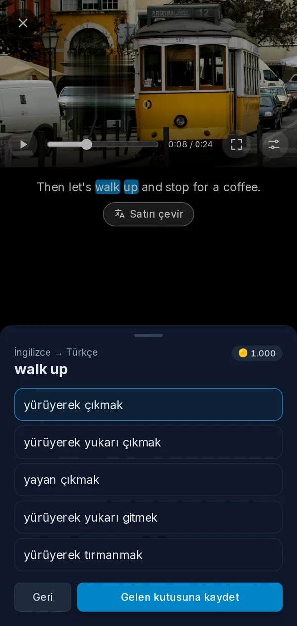 Telefonda oynatıcı: altyazısından bir ifade seçilmiş duraklatılmış bir video ve ifadenin çevirileri