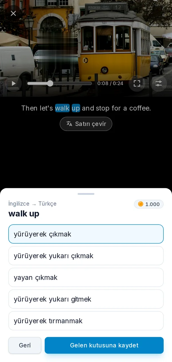 Telefonda oynatıcı: altyazısından bir ifade seçilmiş duraklatılmış bir video ve ifadenin çevirileri