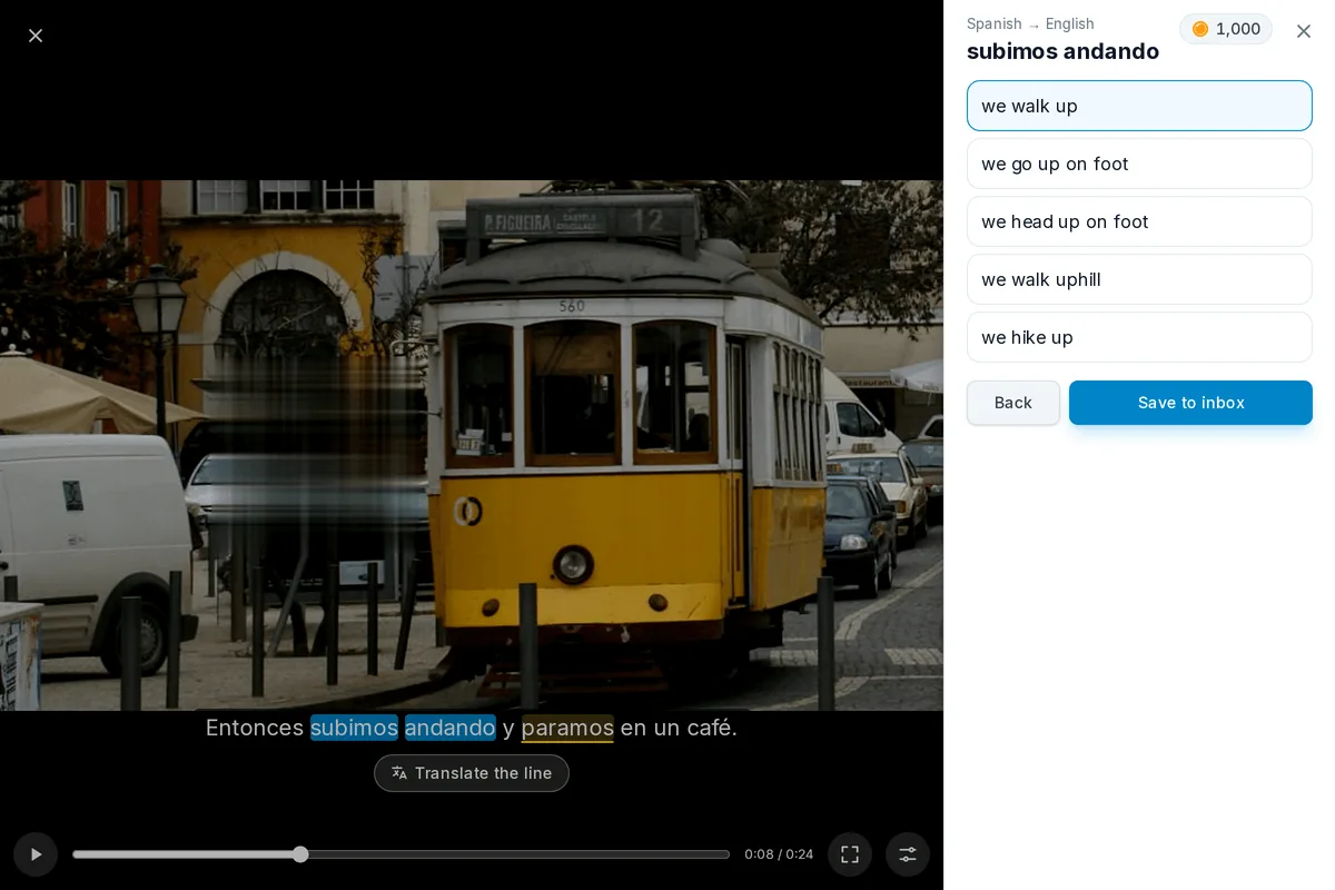 A paused video with a line of subtitles, two words of it picked as a phrase and their translations open below